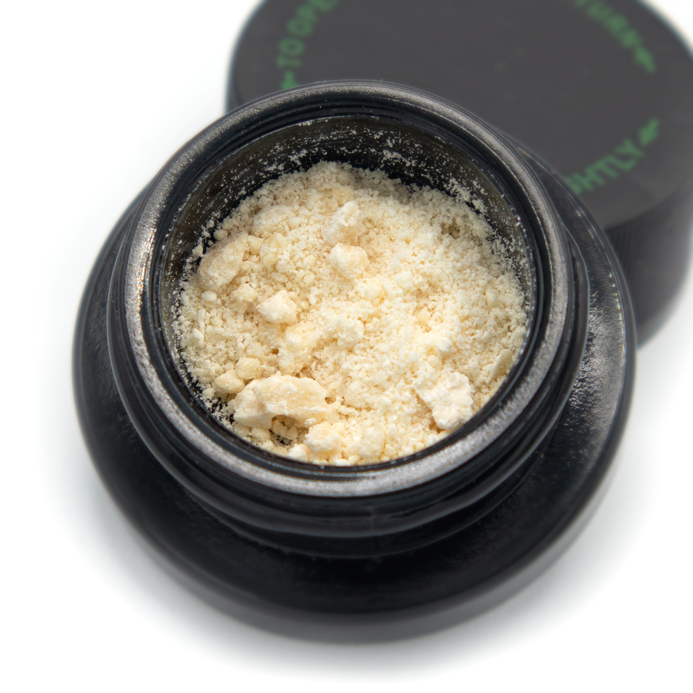 Close up of a container holding our GraniteLeaf Crumble concentrate.
