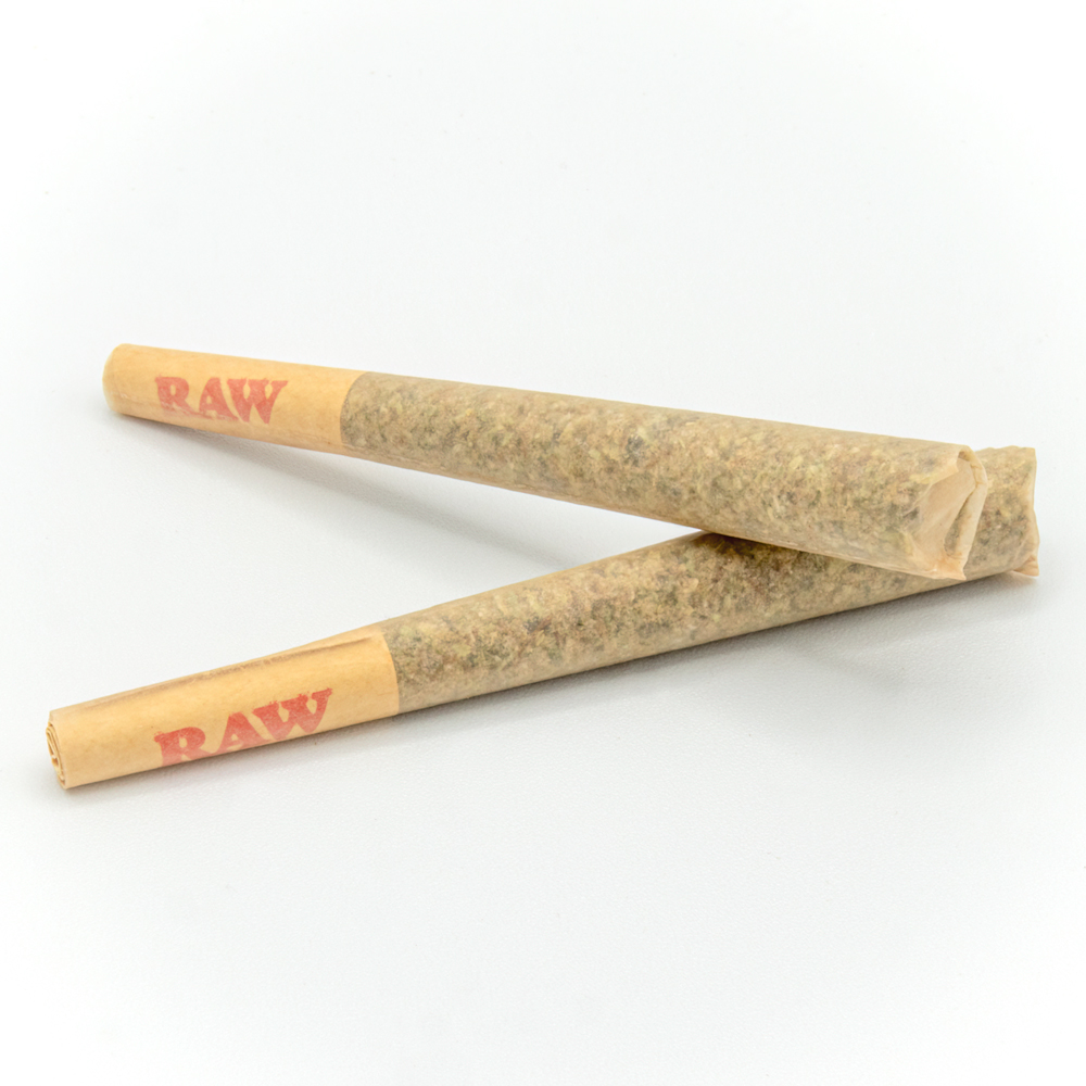 Two pre-rolled joints on a white background.