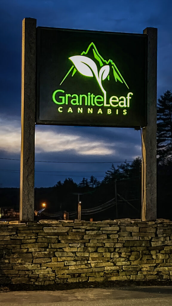 our new sign at dusk, illuminated